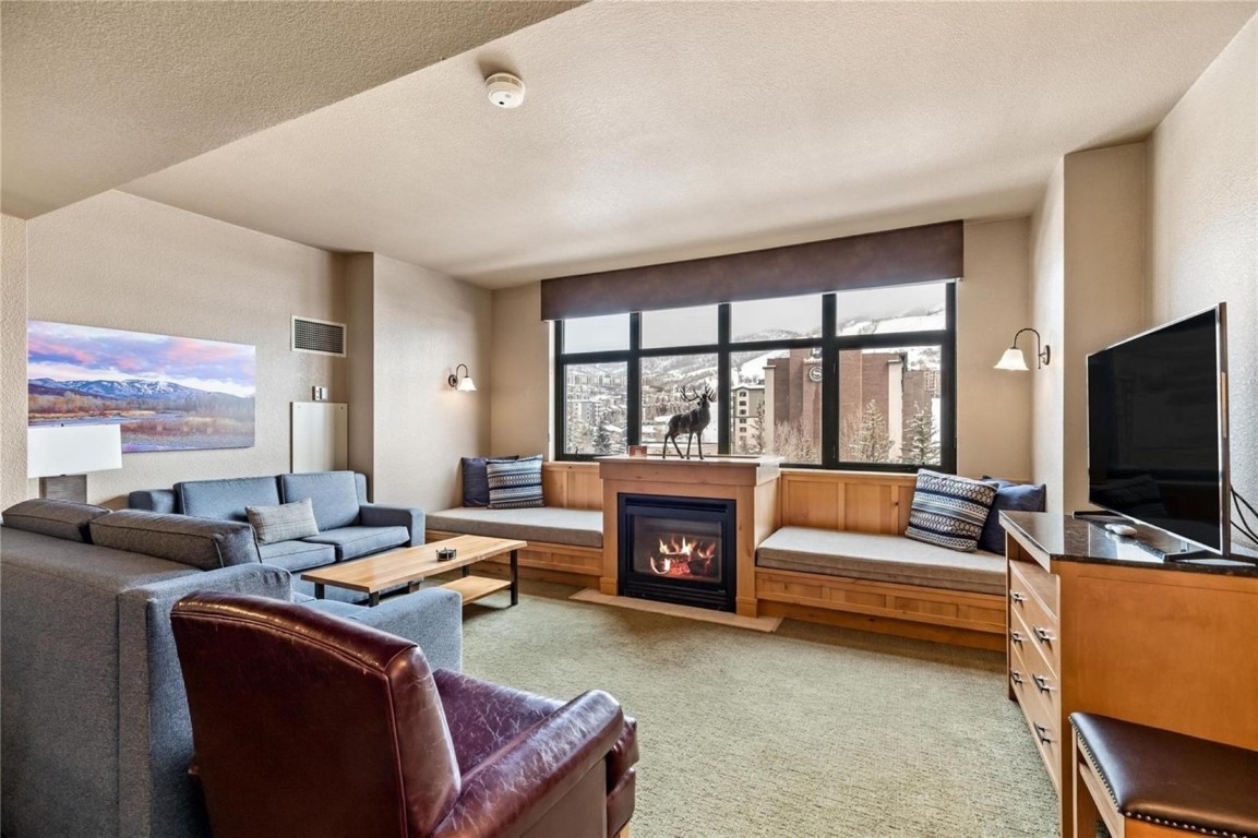 Example of Steamboat Grand's Parlor Room with its inviting fireplace and daybeds.