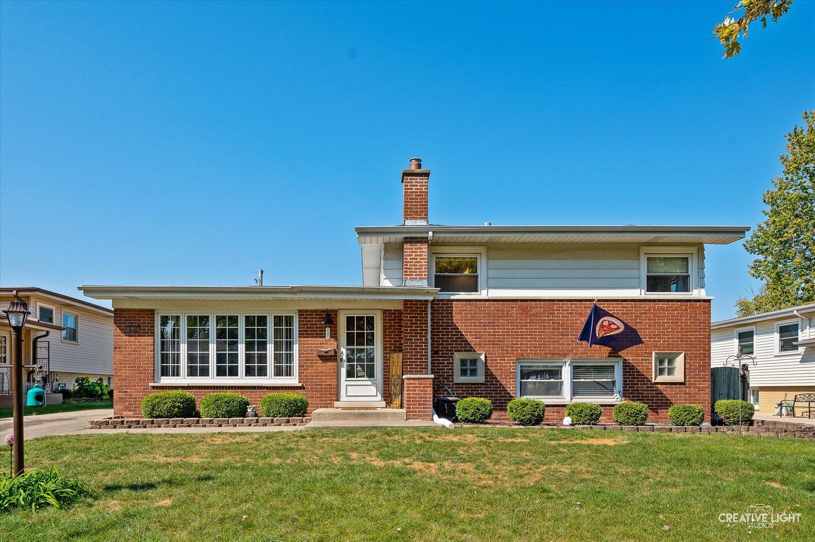 front view of a house with a yard