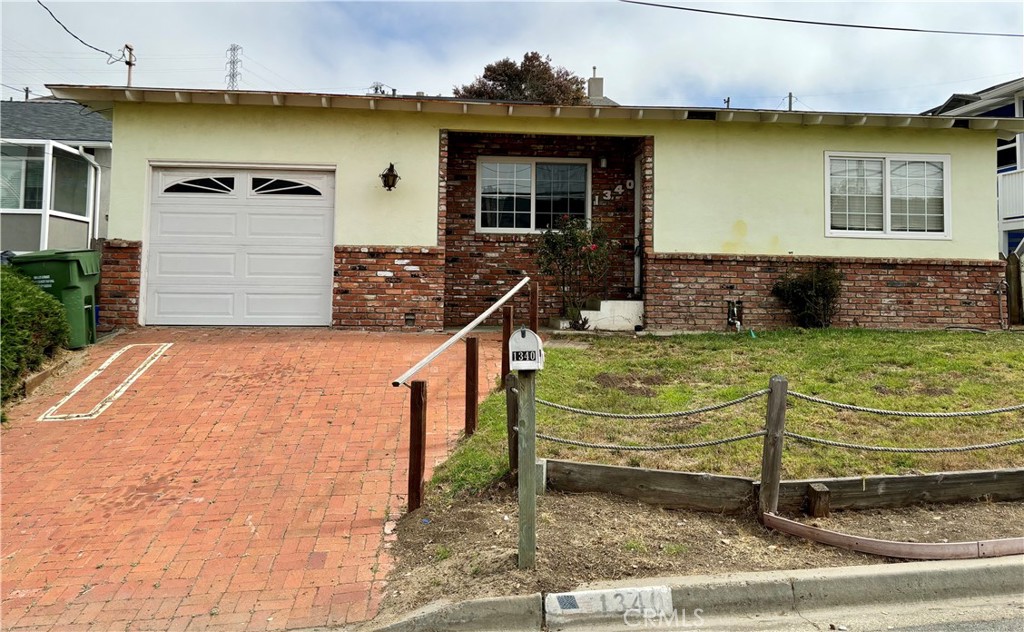 a view of a house with more windows and a yard