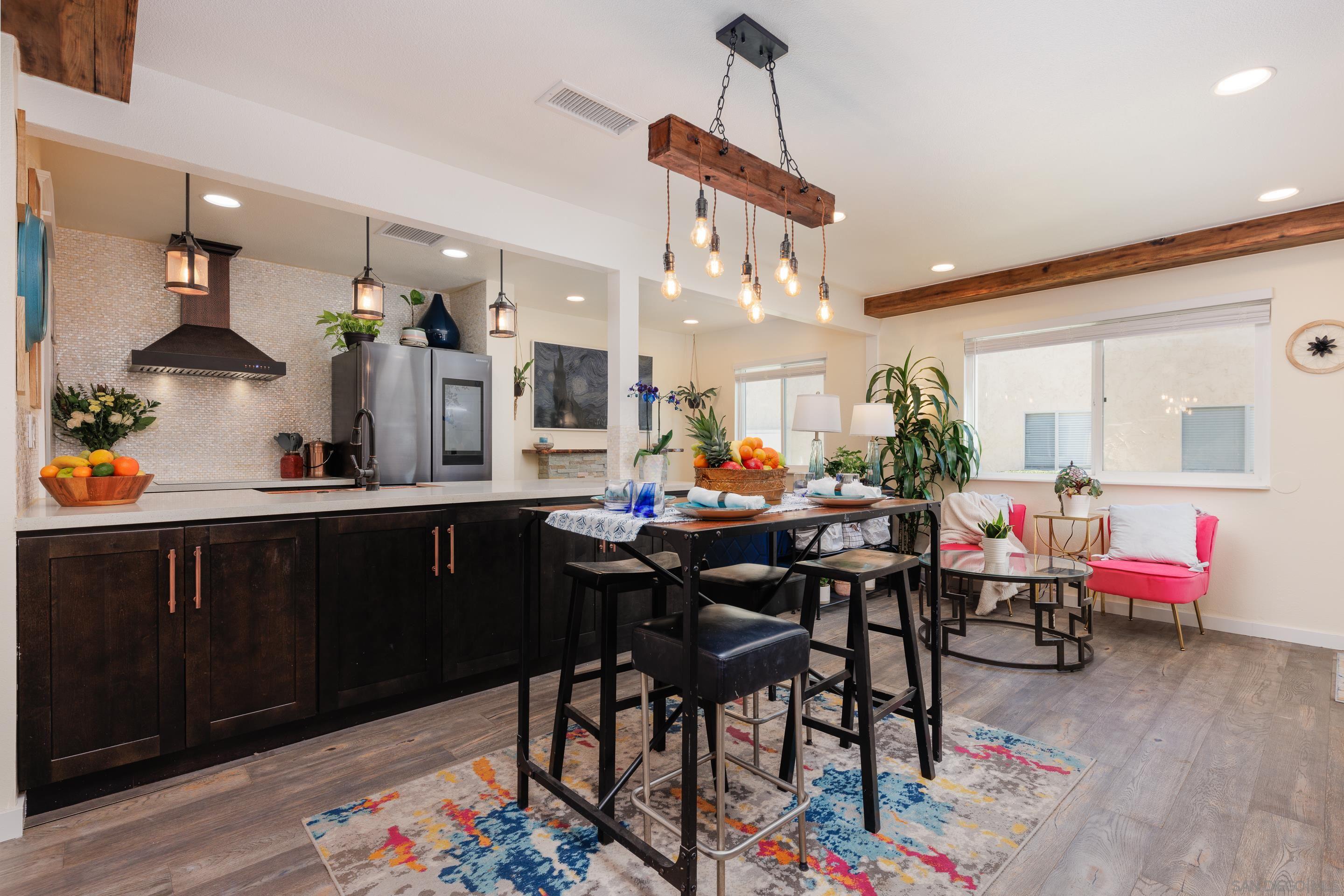 a room with granite countertop furniture and wooden floor