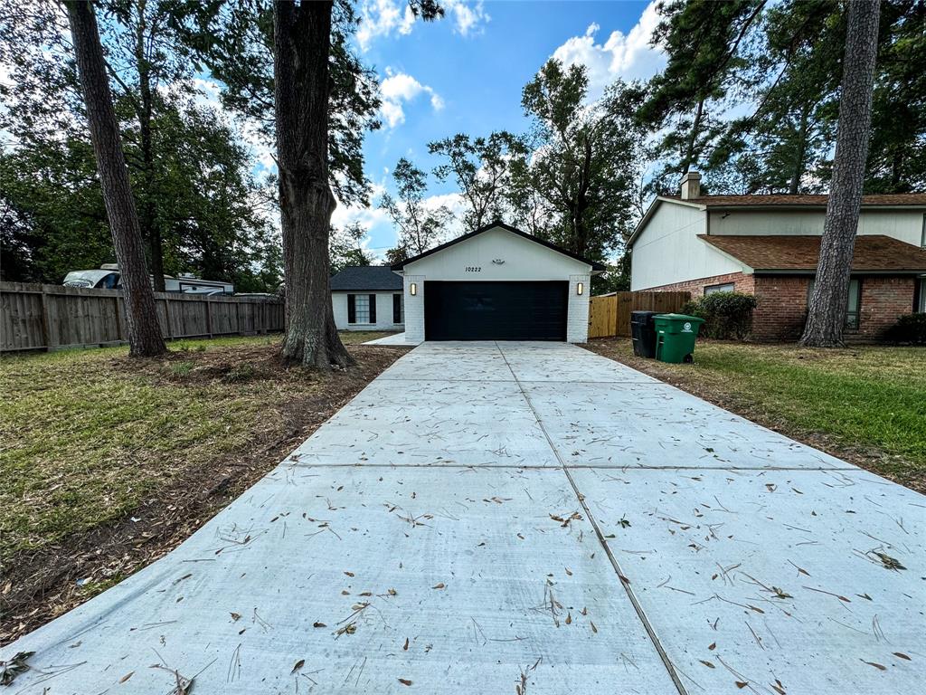 Welcome to 10222 Valley Wind Dr! Embrace nature with naturally, towering pine trees and enjoy a newly poured driveway that can easily fit 4 cars.