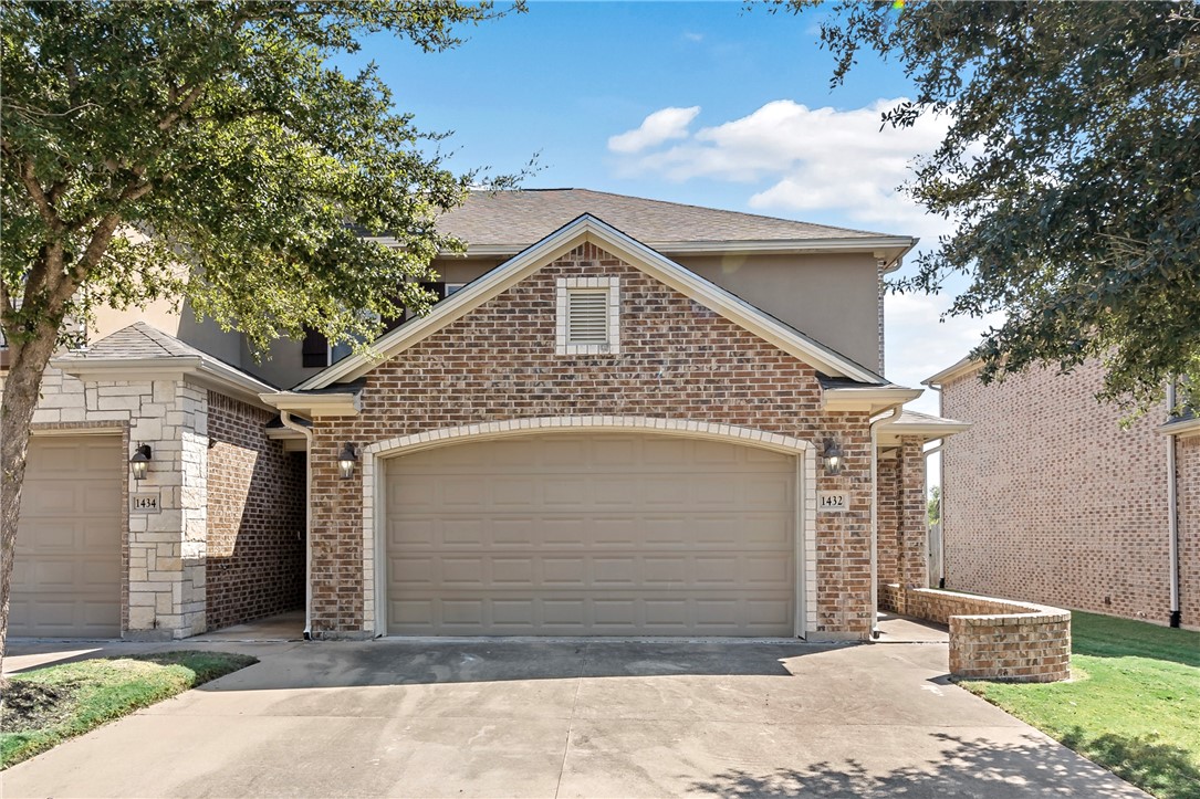 a front view of a house with a garage