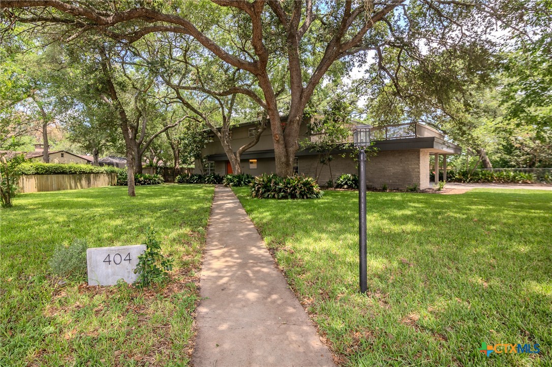 a view of a backyard with a garden