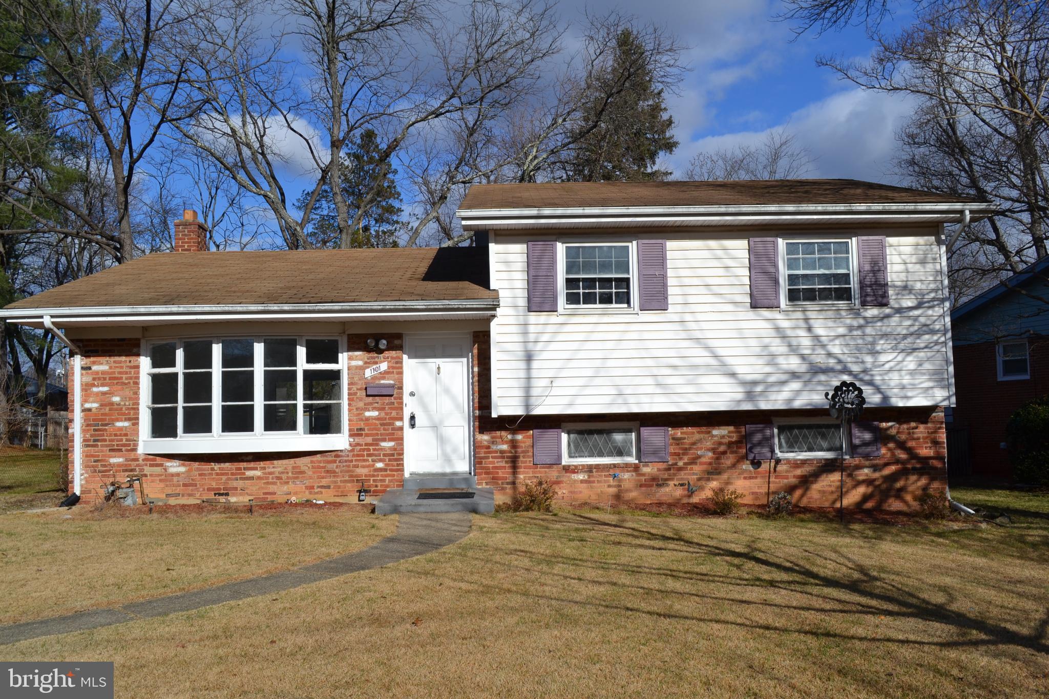 a front view of a house with a garage