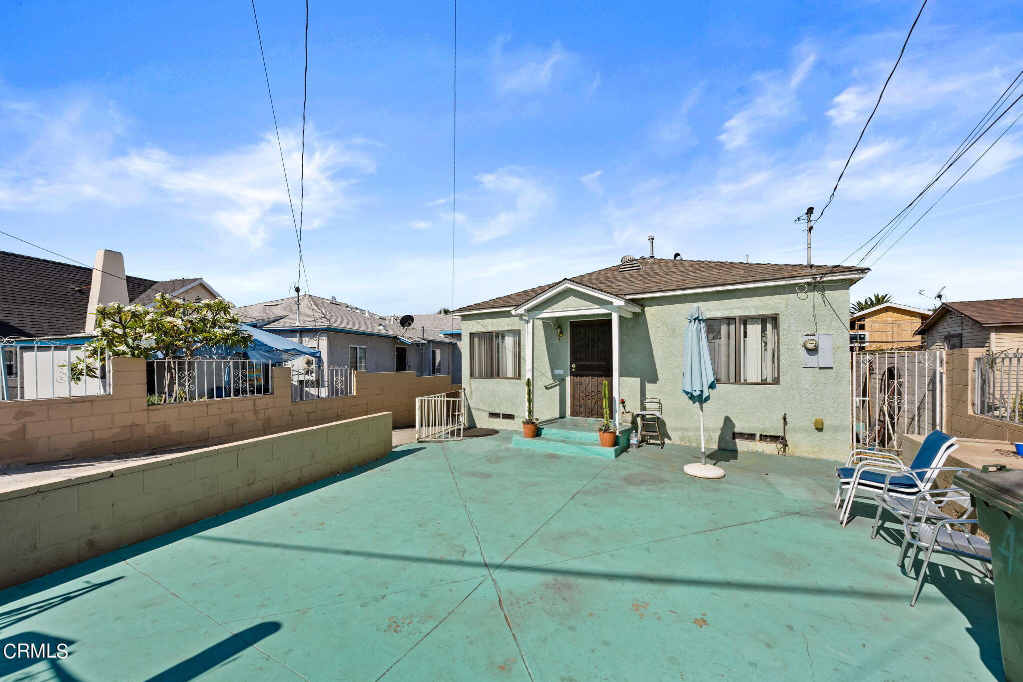 a front view of a house with sitting area