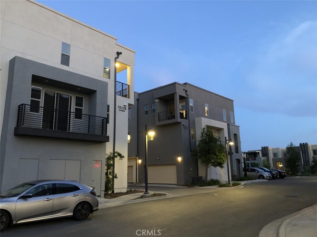 a couple of cars parked in front of a building