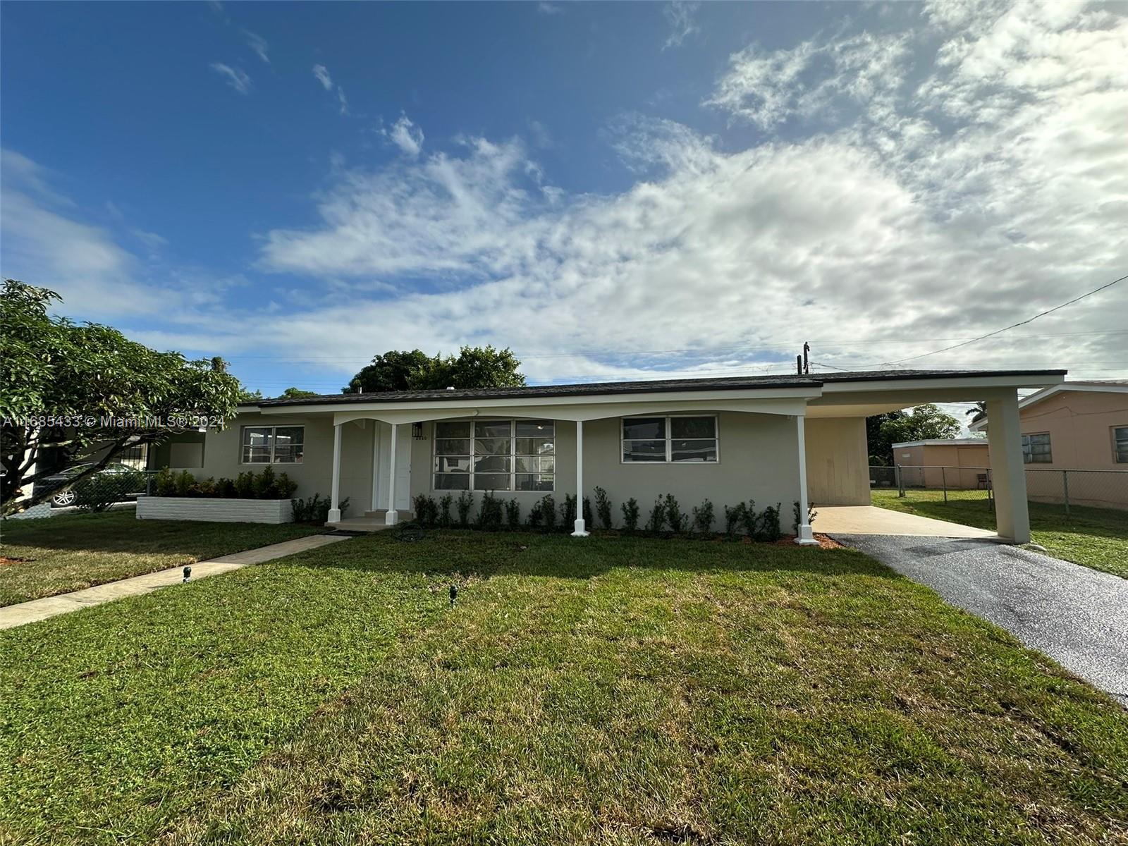 front view of a house with a yard