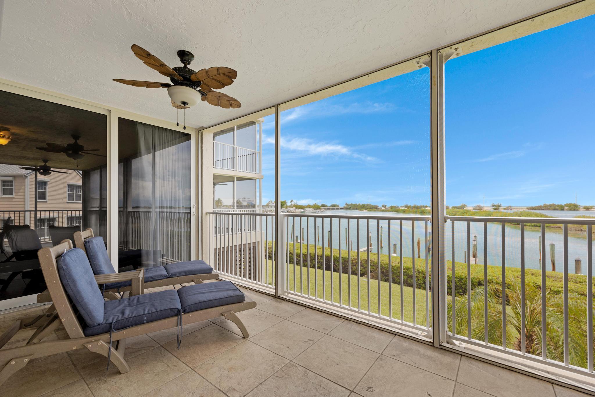 a view of a balcony with furniture