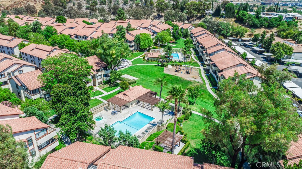 an aerial view of a house with yard