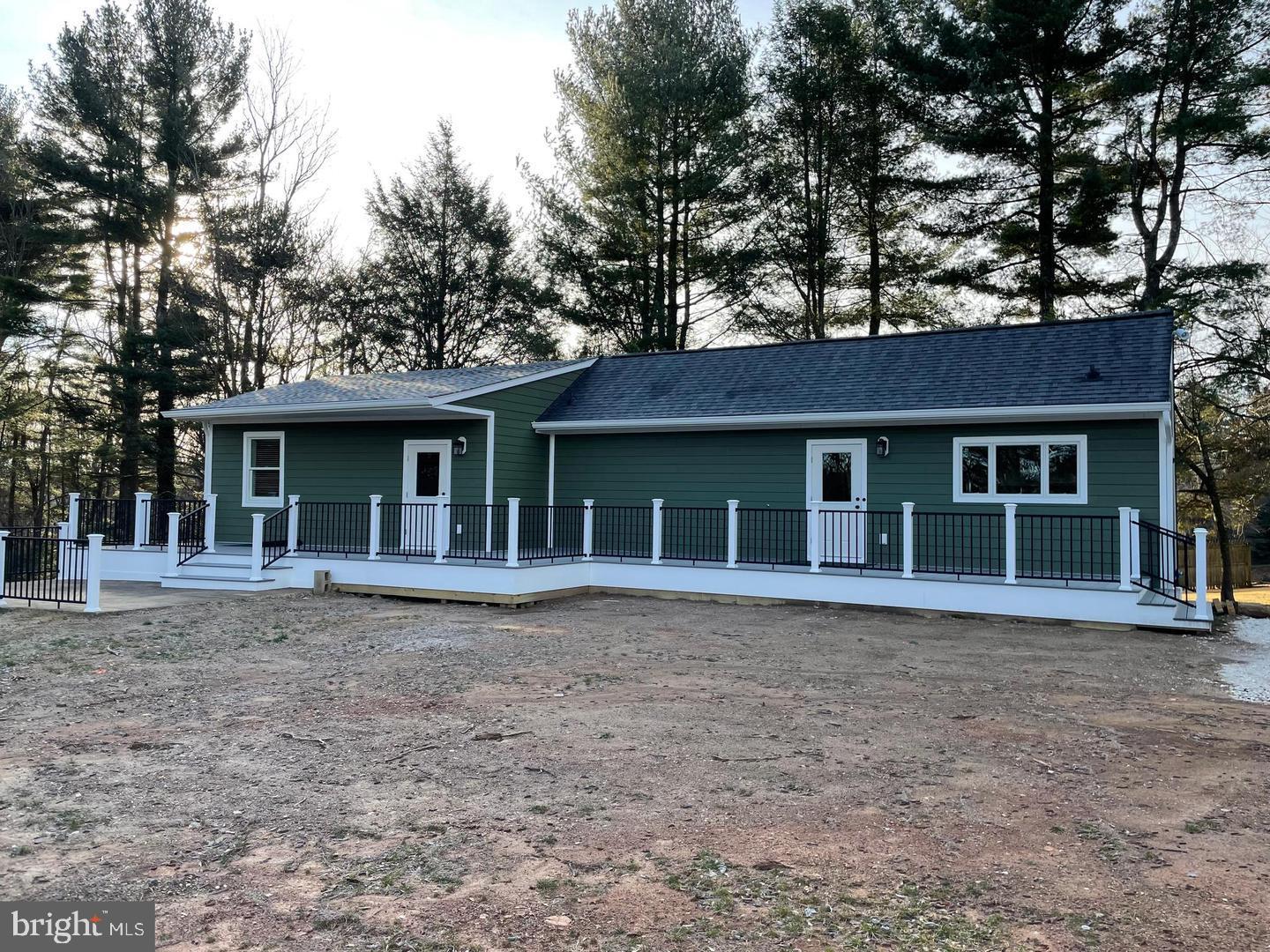 front view of the house and a yard