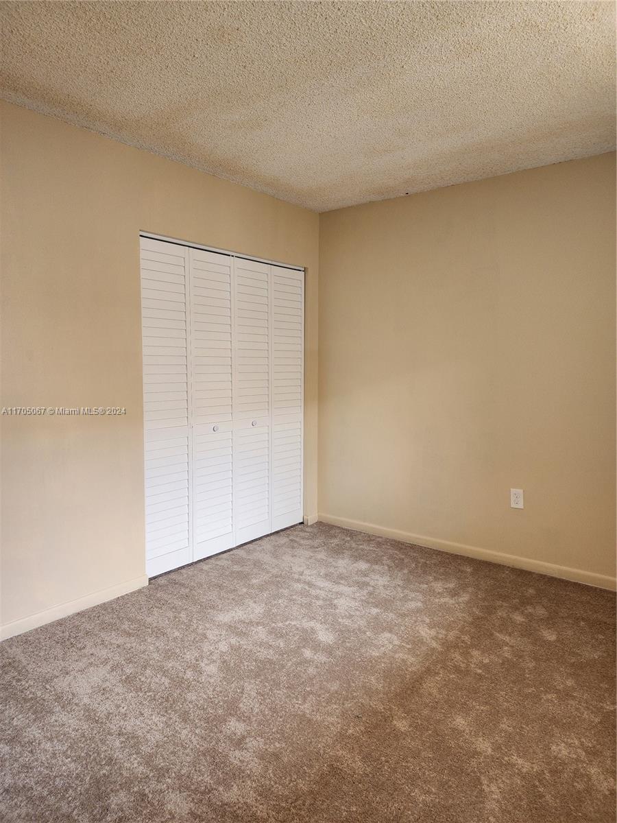 a view of an empty room and entryway