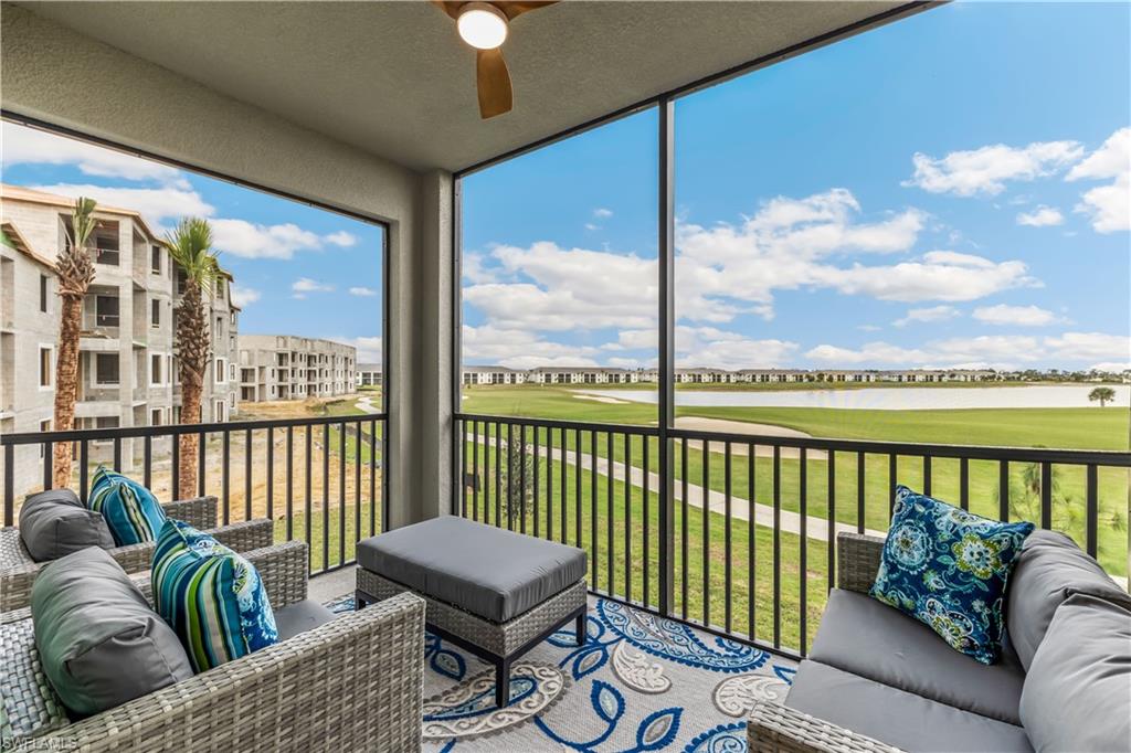 a balcony with furniture and city view