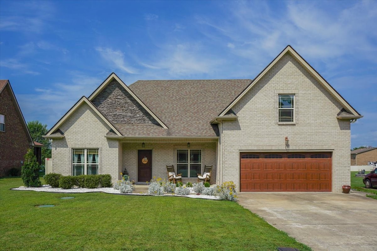 front view of a house with a yard