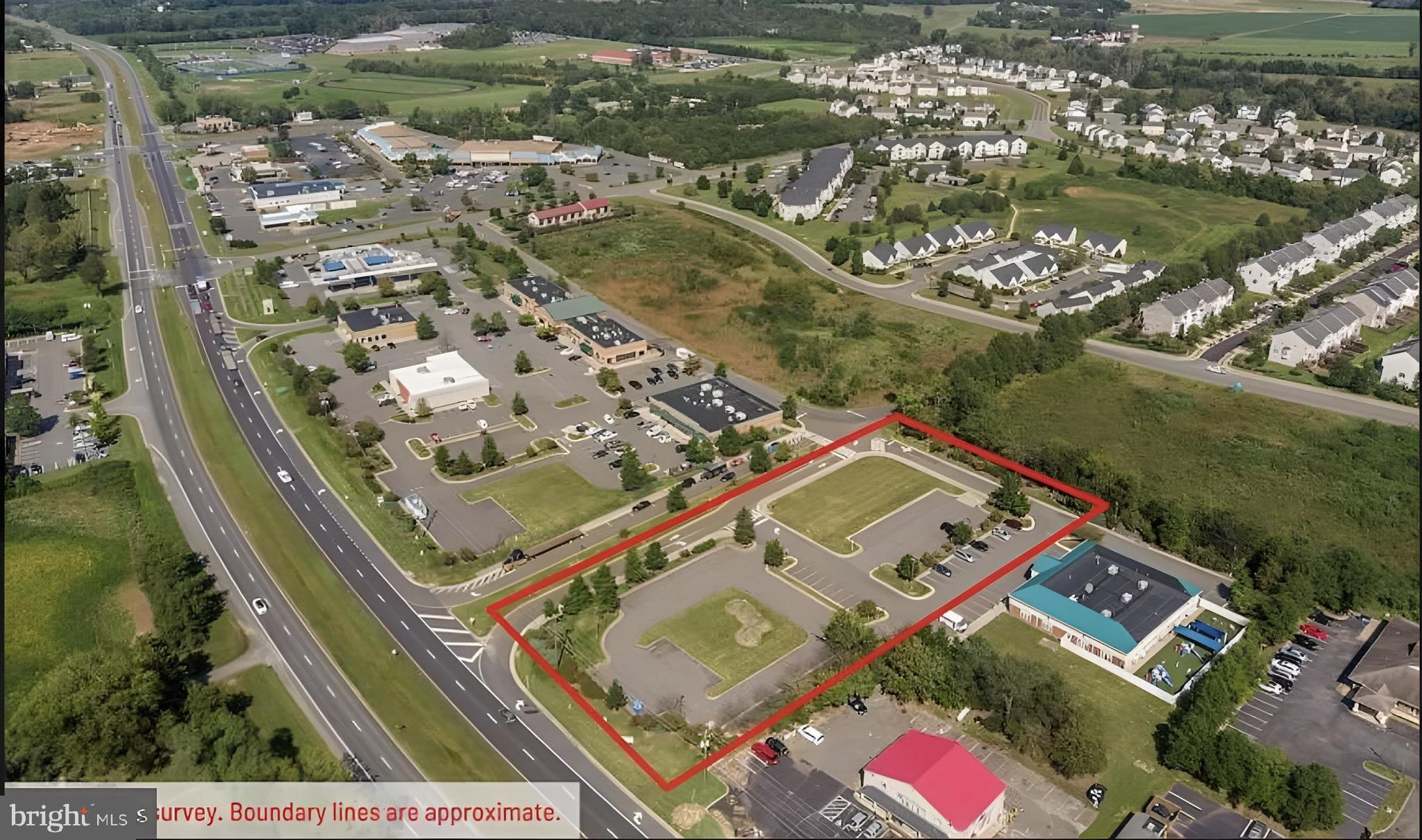 an aerial view of a residential houses with outdoor space