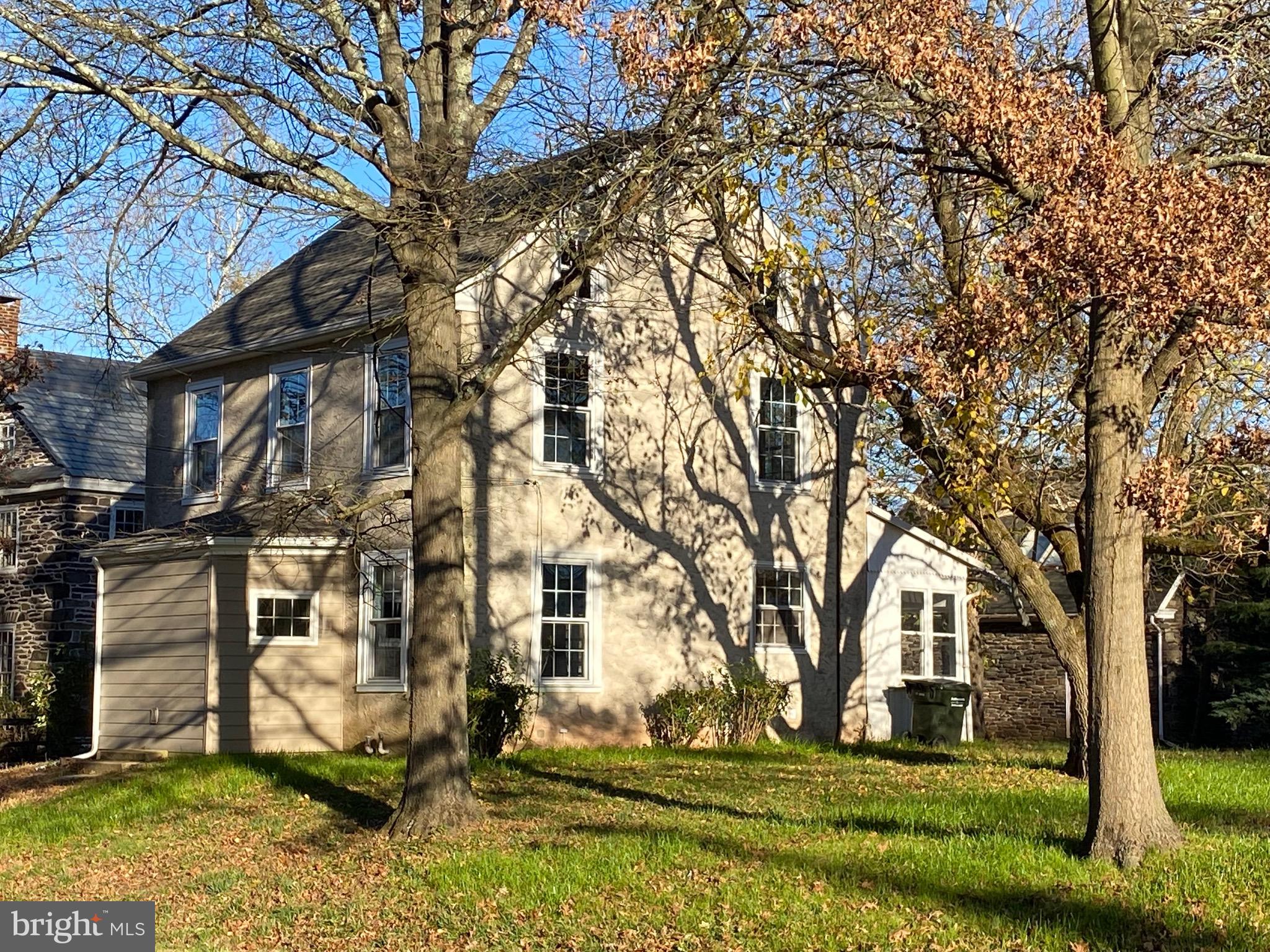 a view of house with yard