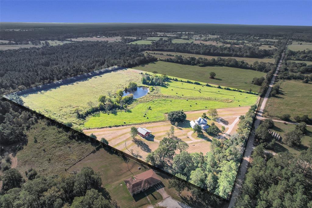 An aerial view captures the stunning beauty of this expansive property, showcasing its vast landscapes and natural charm. Custom home and Barndominium built and ready to enjoy!