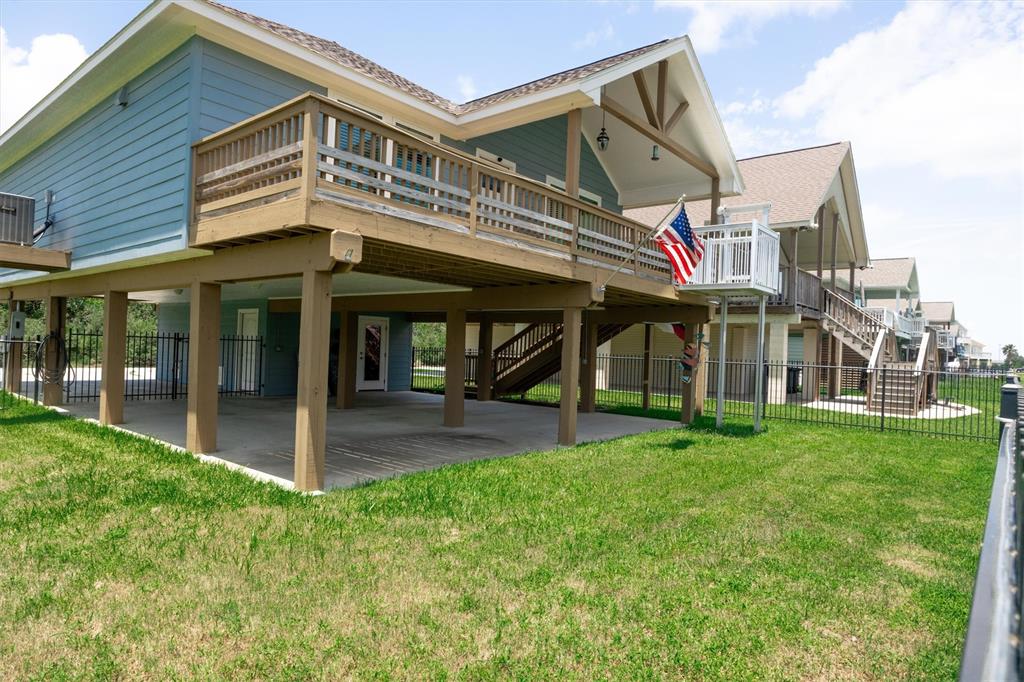 a view of a house with a yard and sitting area