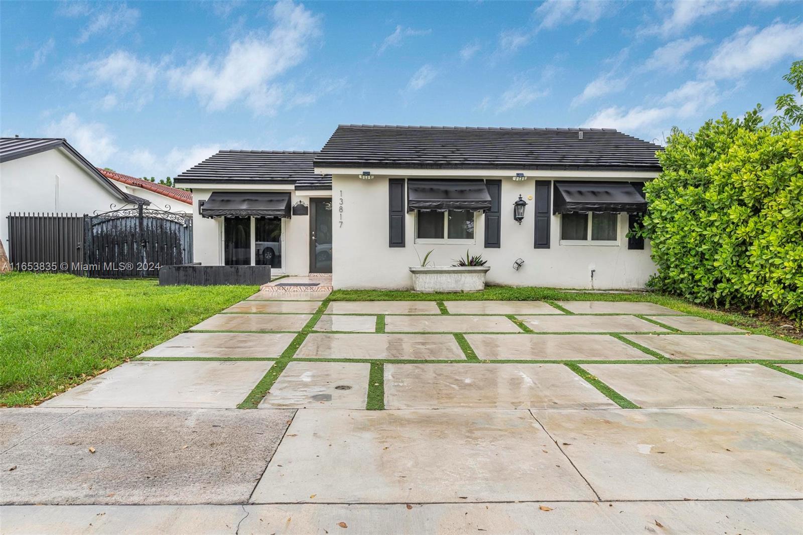 a front view of a house with garden