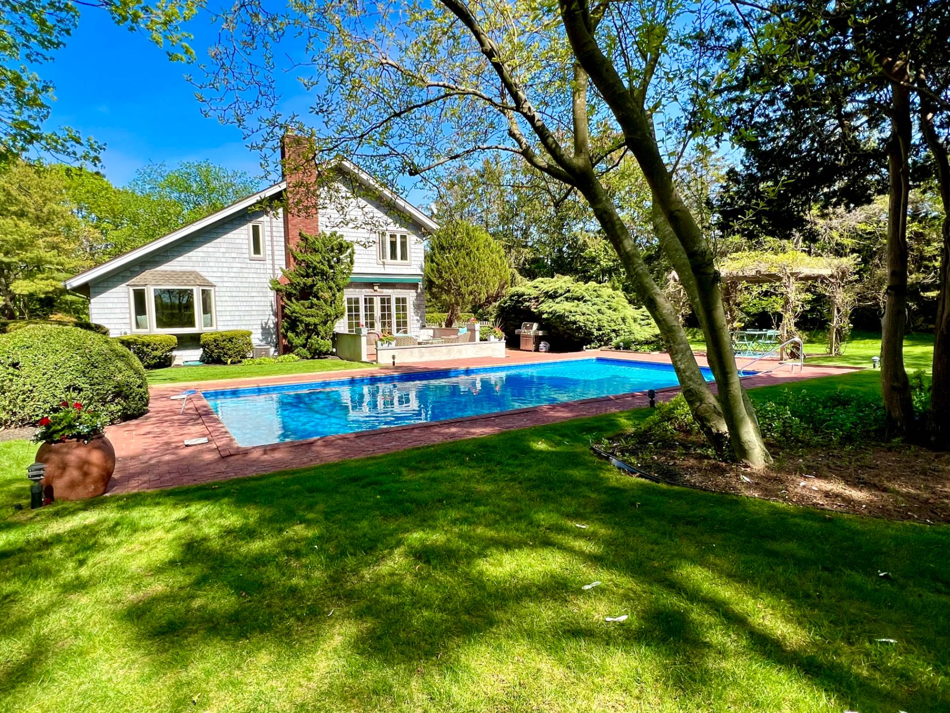 a view of a house with a yard porch and sitting area