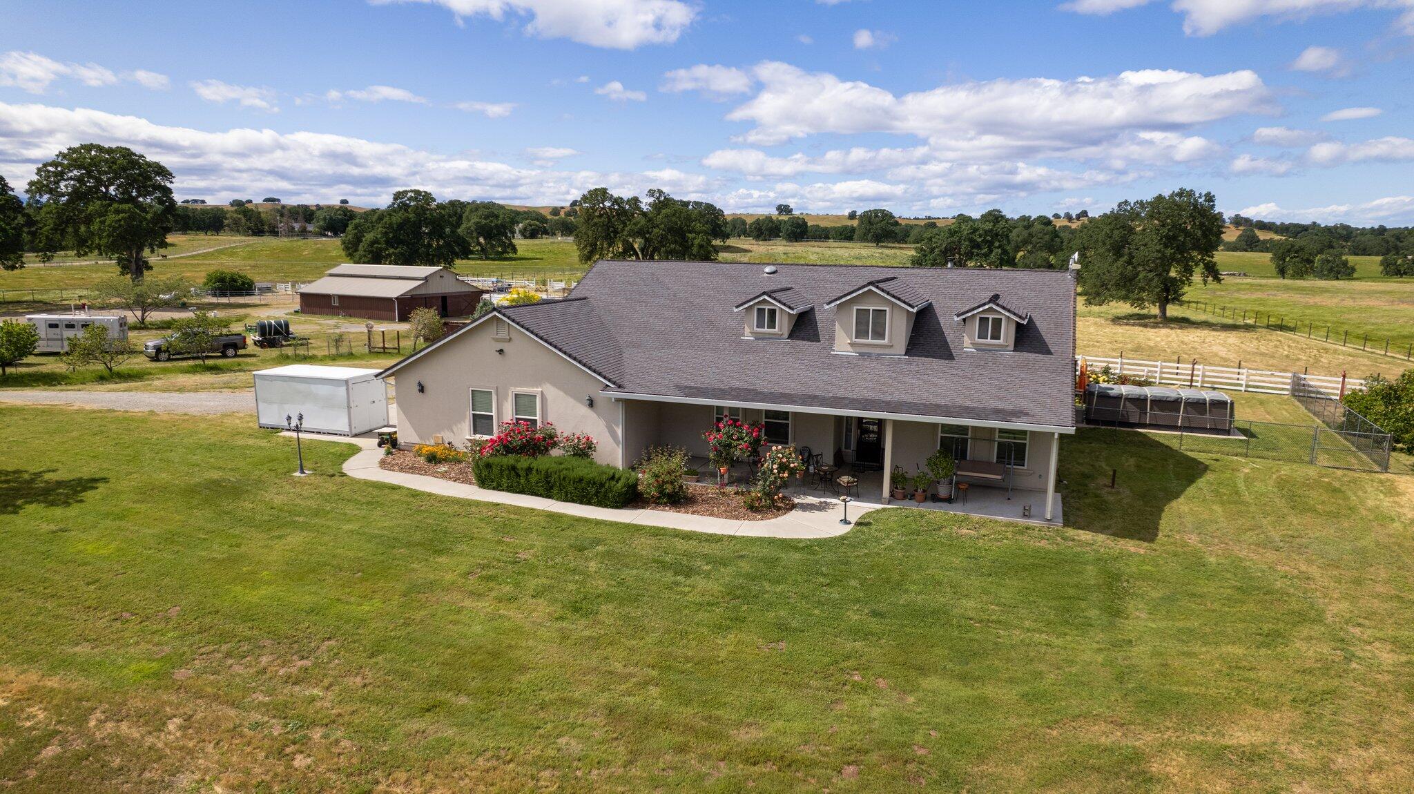 a aerial view of a house with a big yard