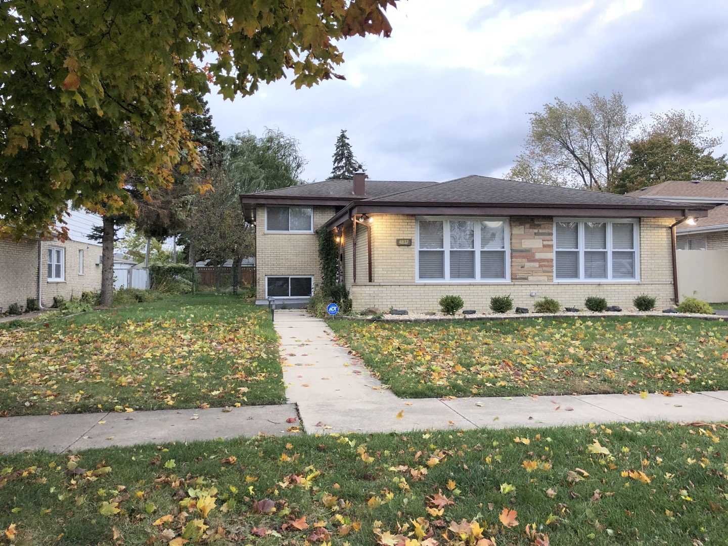 front view of a house with a yard