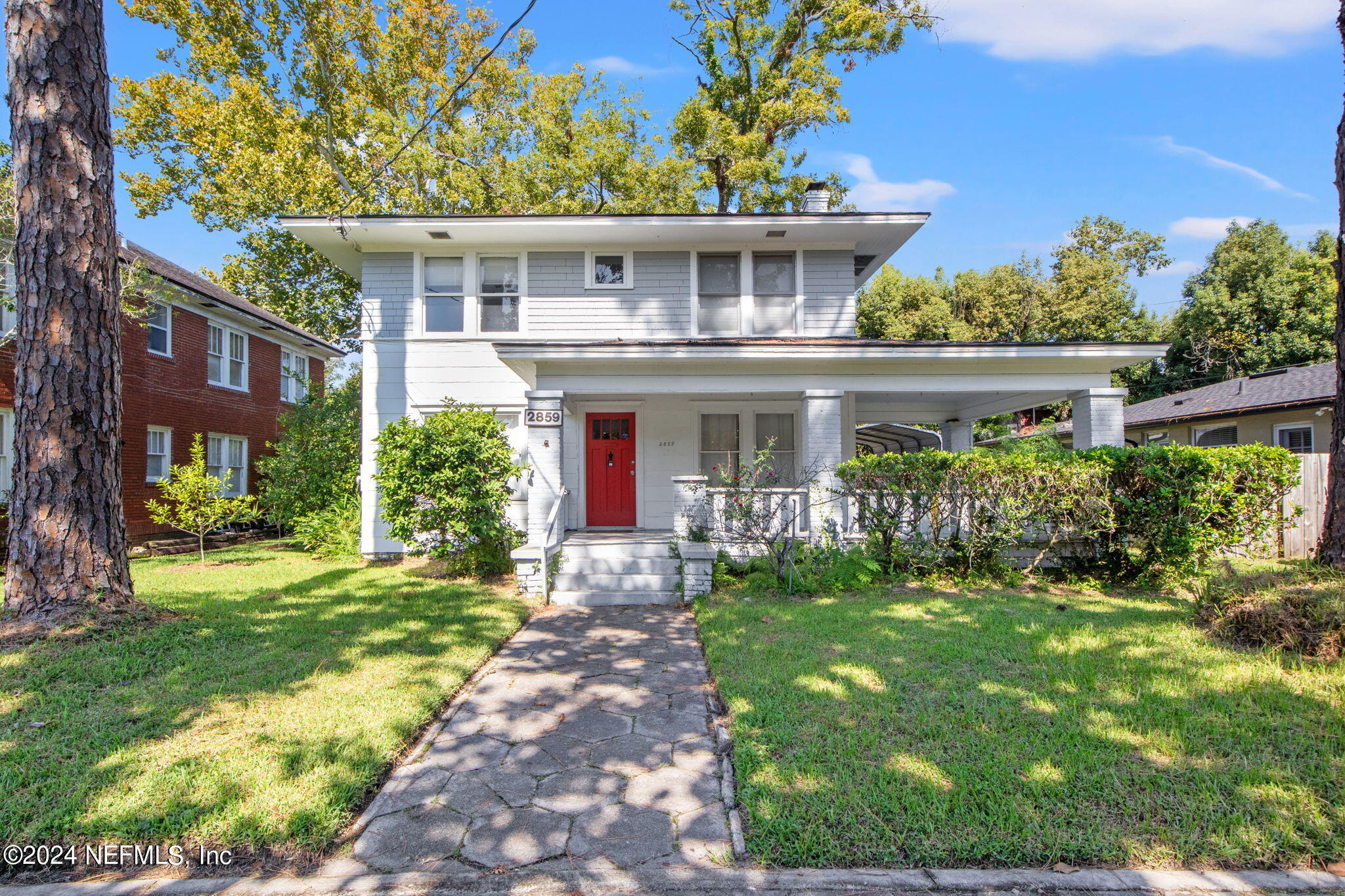 a front view of a house with a yard