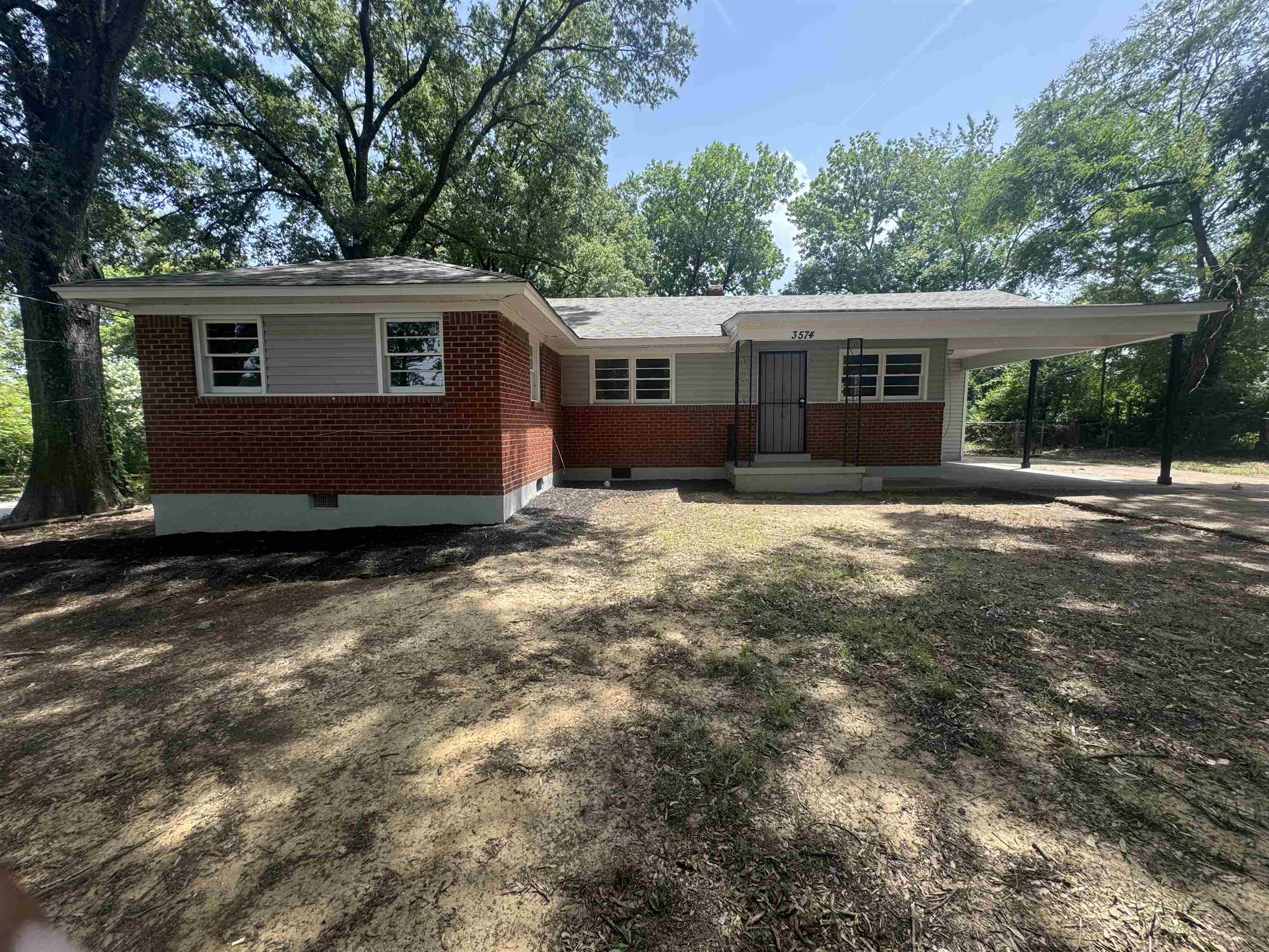 Ranch-style house with a carport