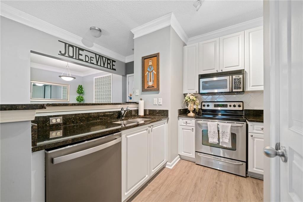 a kitchen with a stove and a microwave