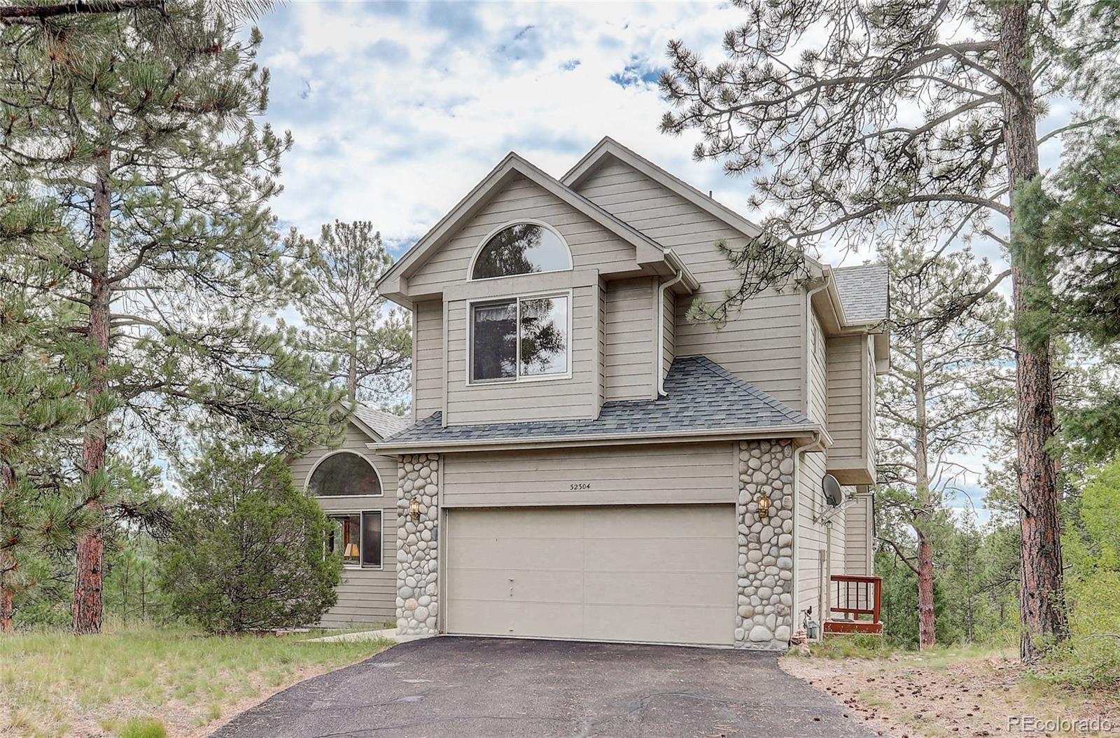 a front view of a house with a garage