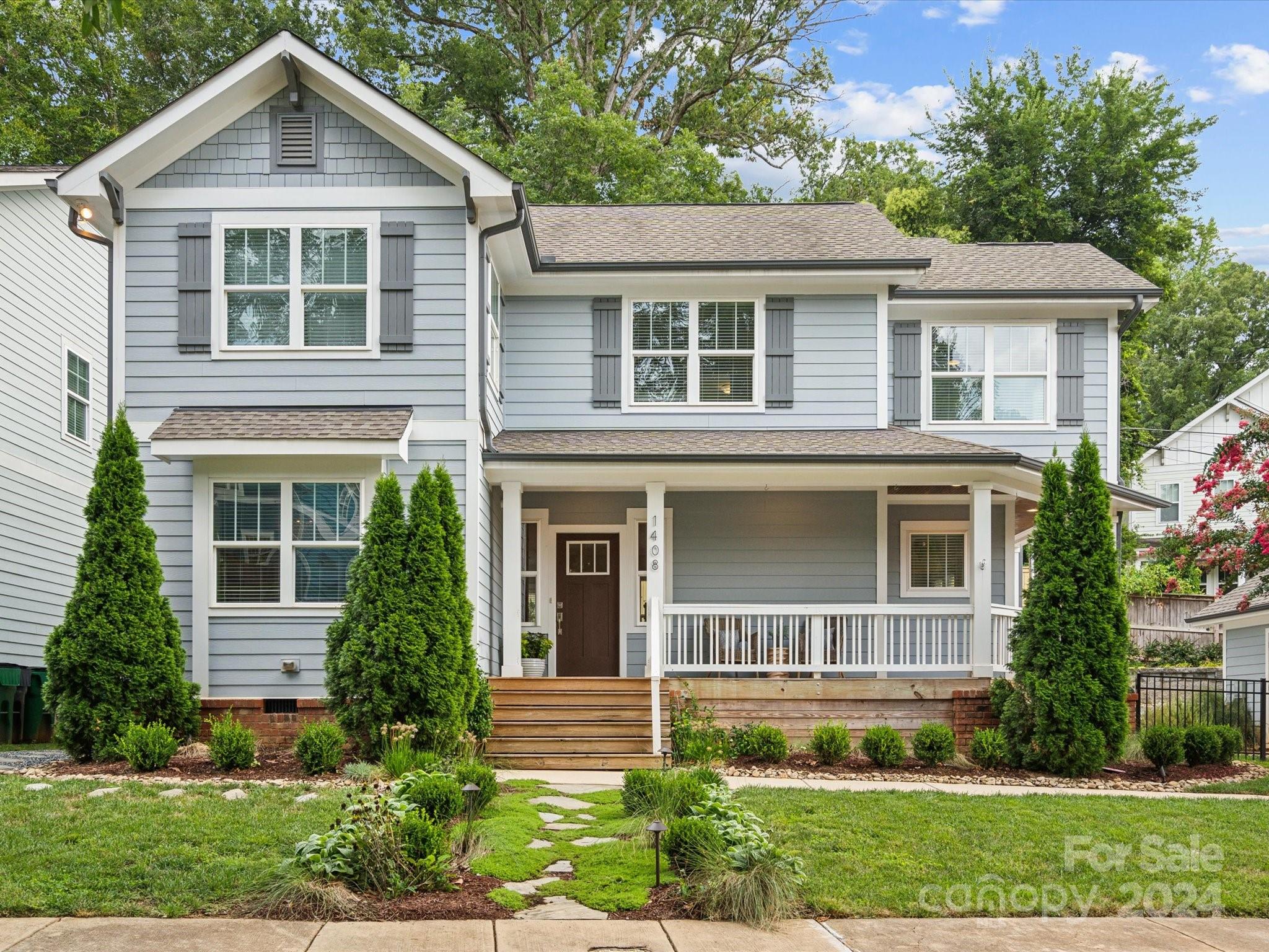 front view of a house with a yard