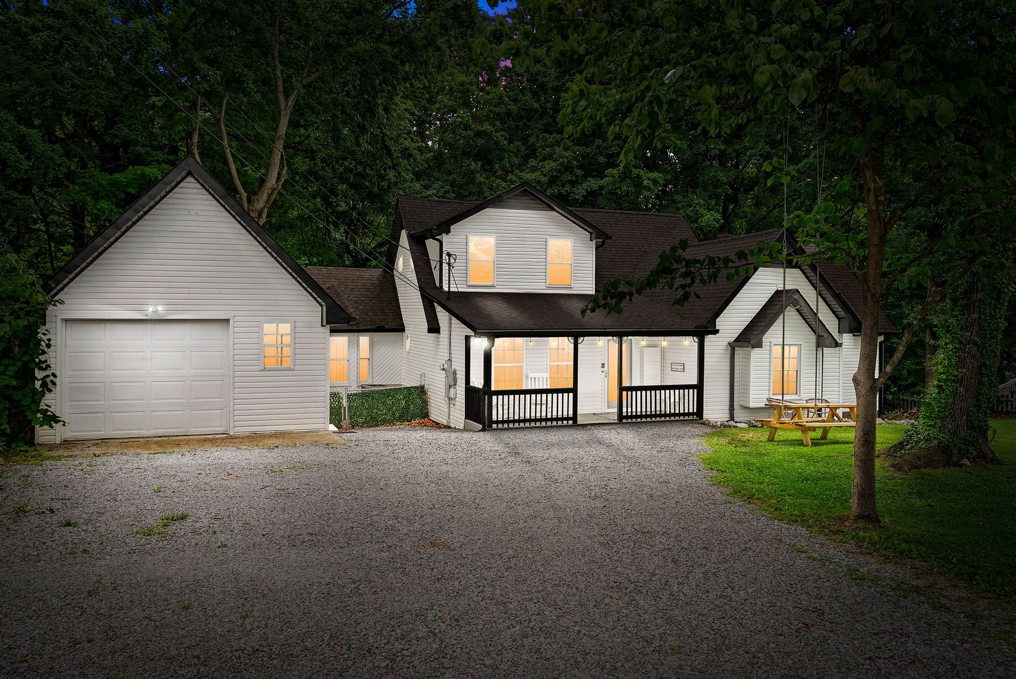 a view of a house with a yard and garage