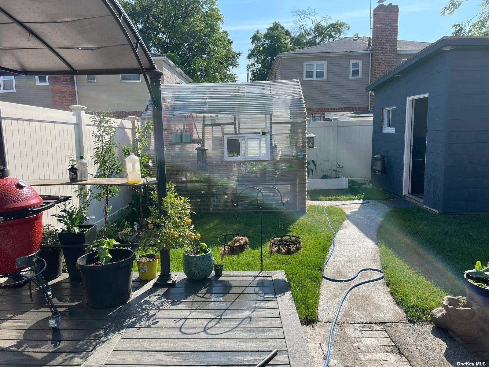 a view of a chair and table in backyard