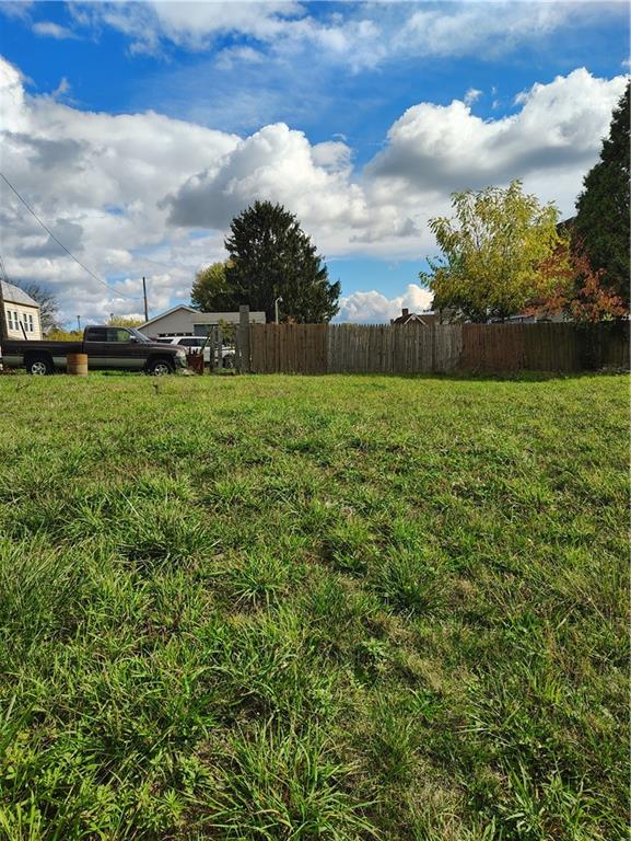 a view of a yard with an trees