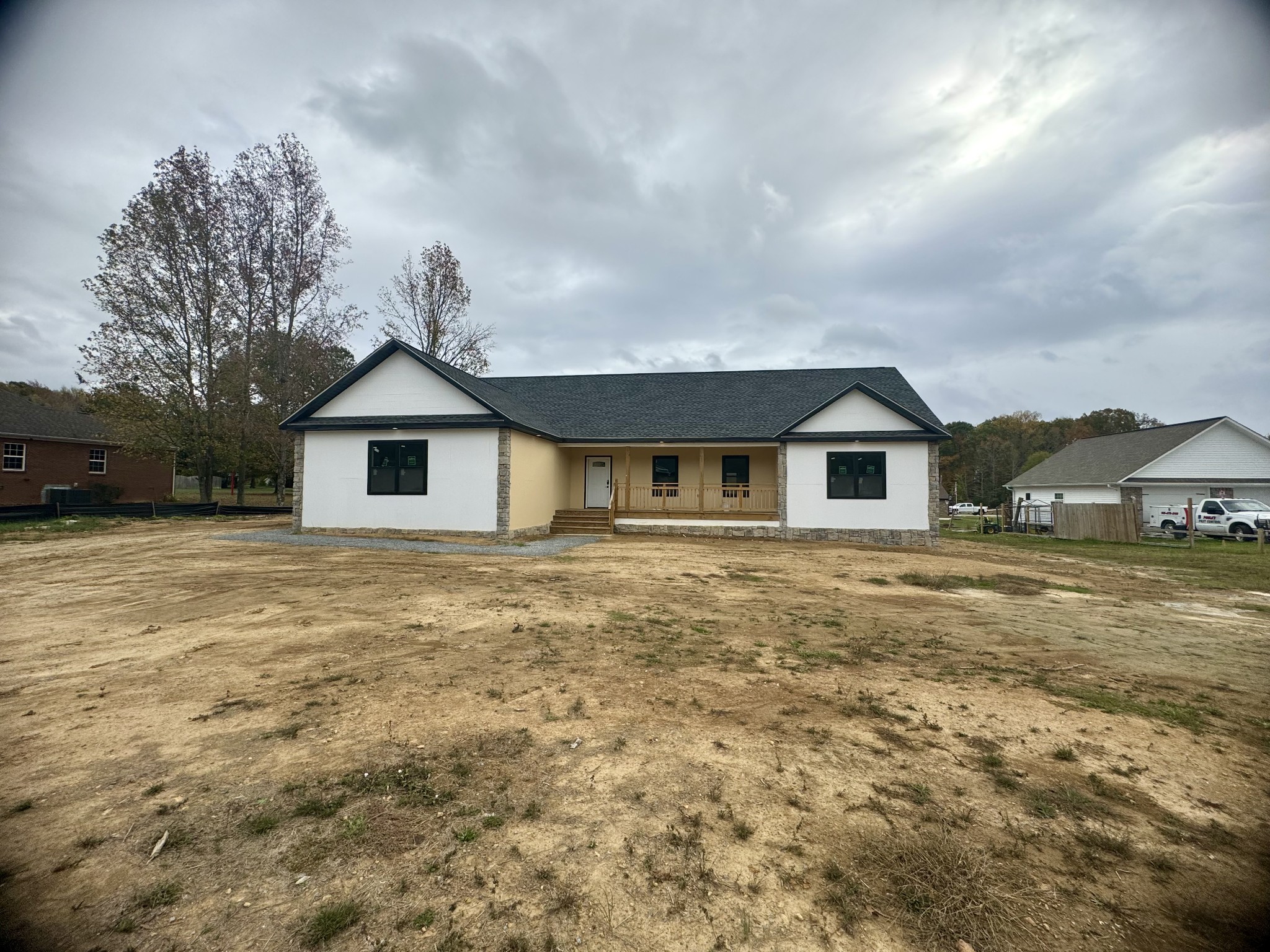 a front view of a house with a yard