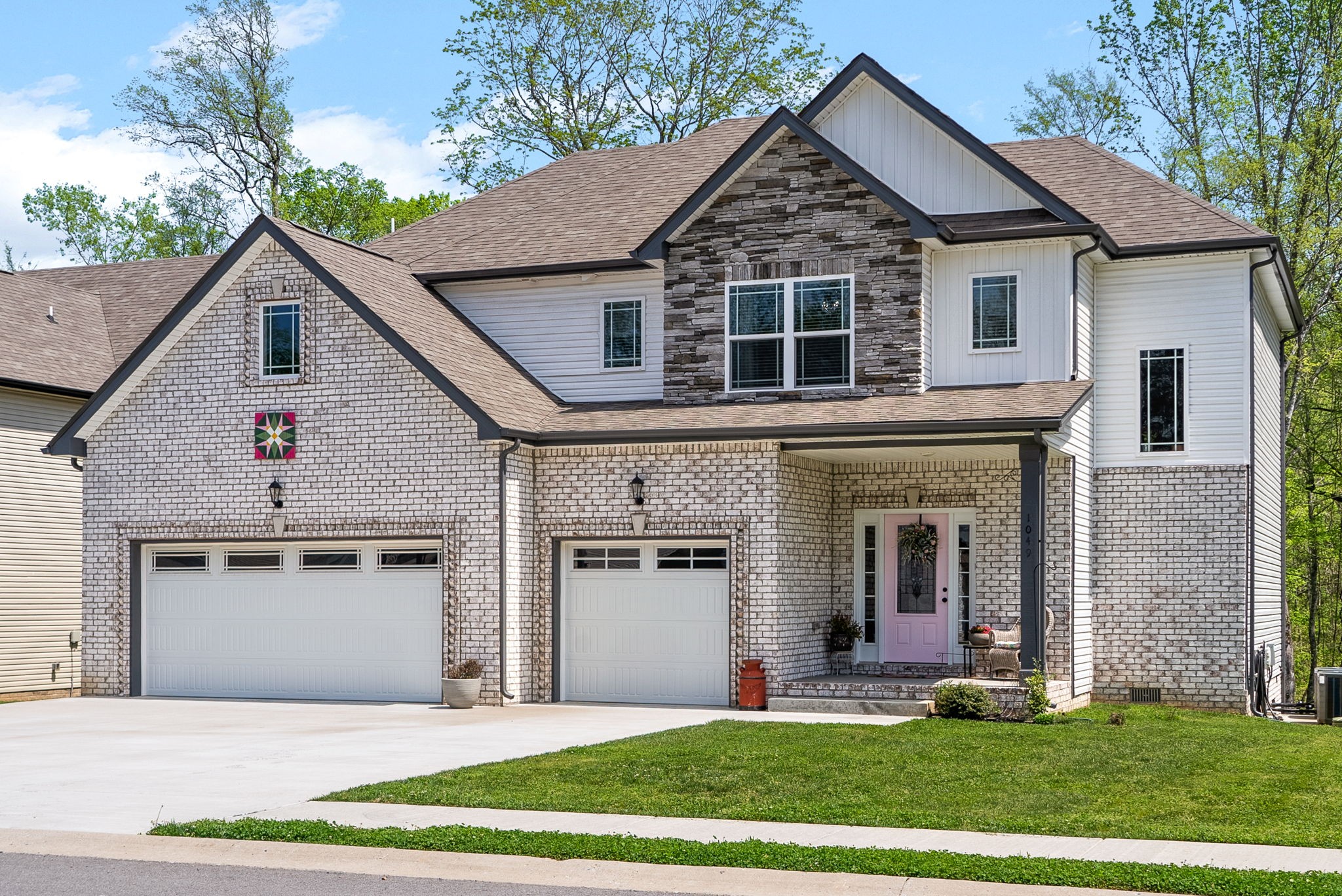 a view of a yard in front view of a house