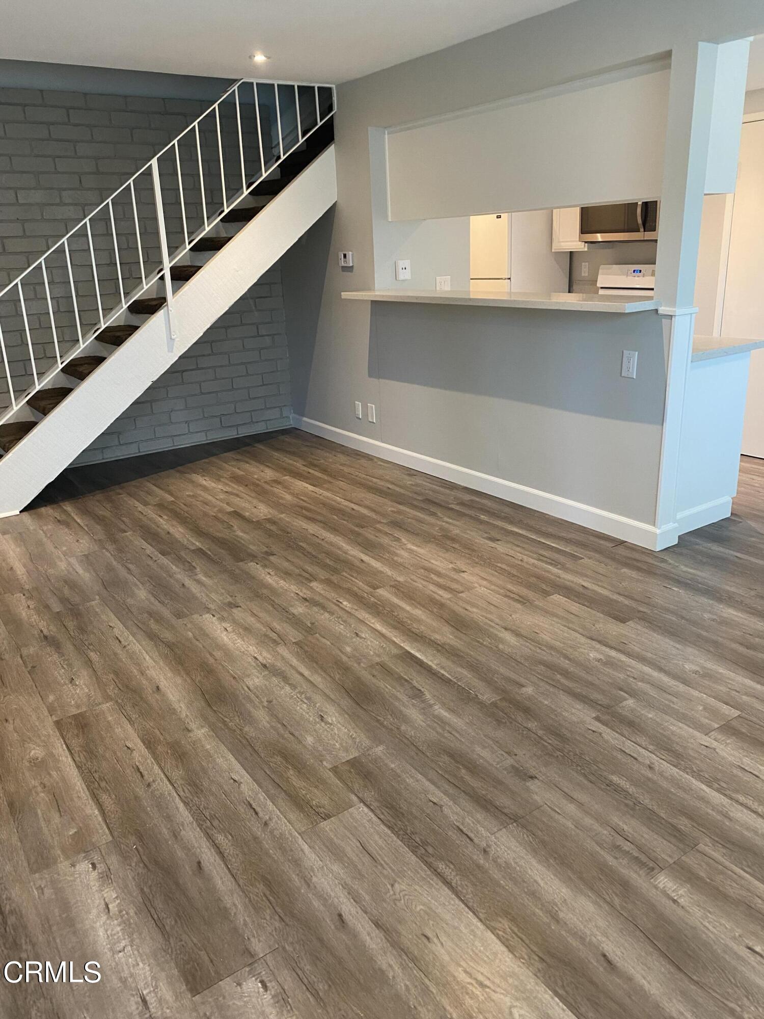 a view of entryway with wooden floor