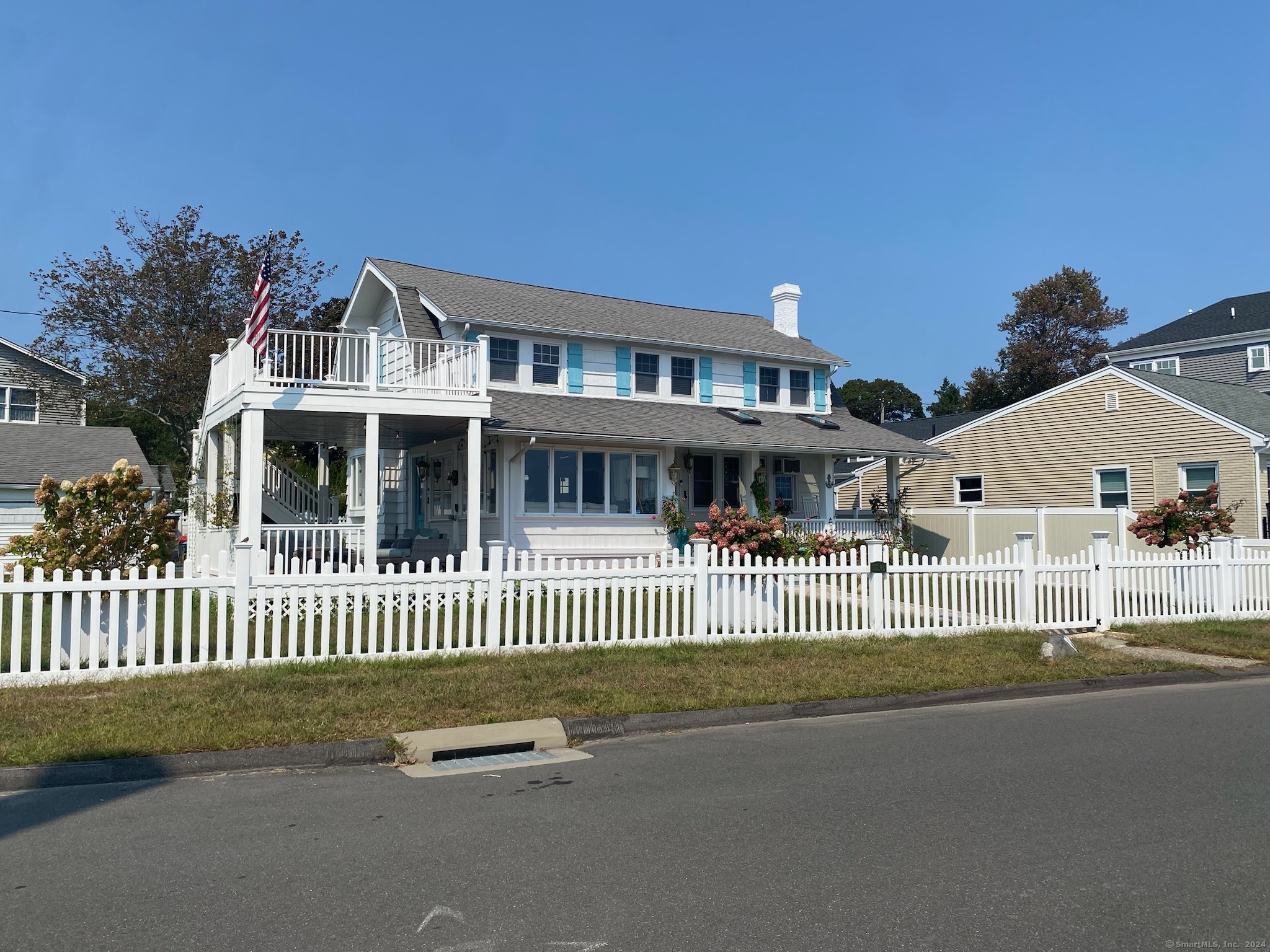 a front view of a house with a fence