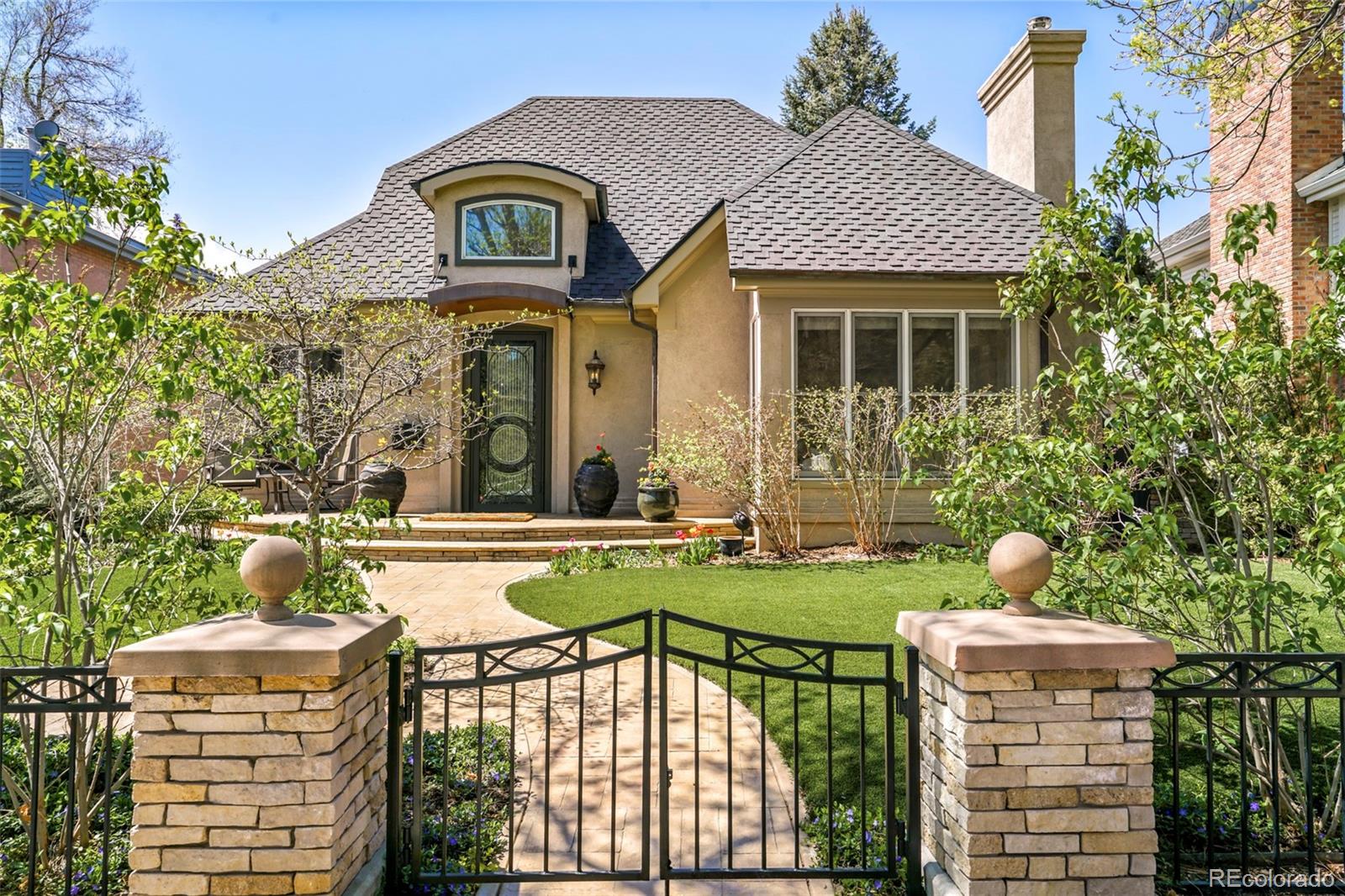 a front view of a house with garden