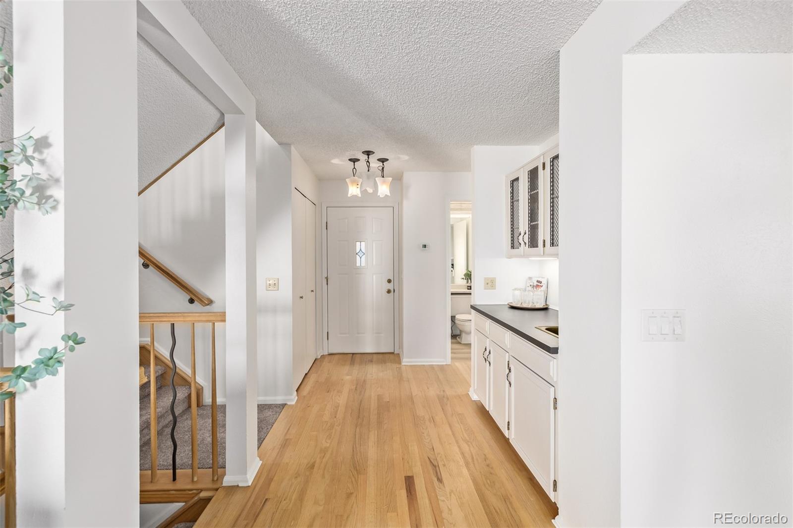 a view of a kitchen from the hallway