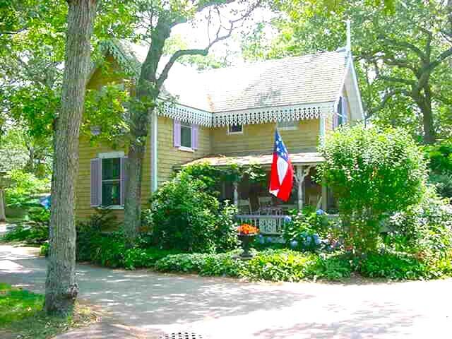 a view of fountain in front of a house