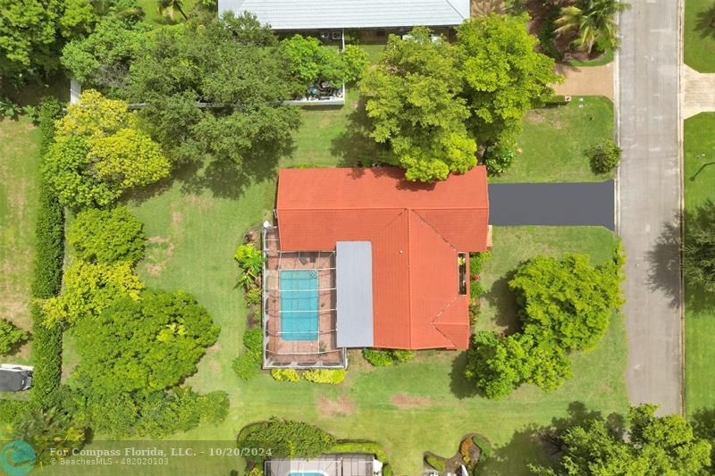 an aerial view of residential house with an outdoor space