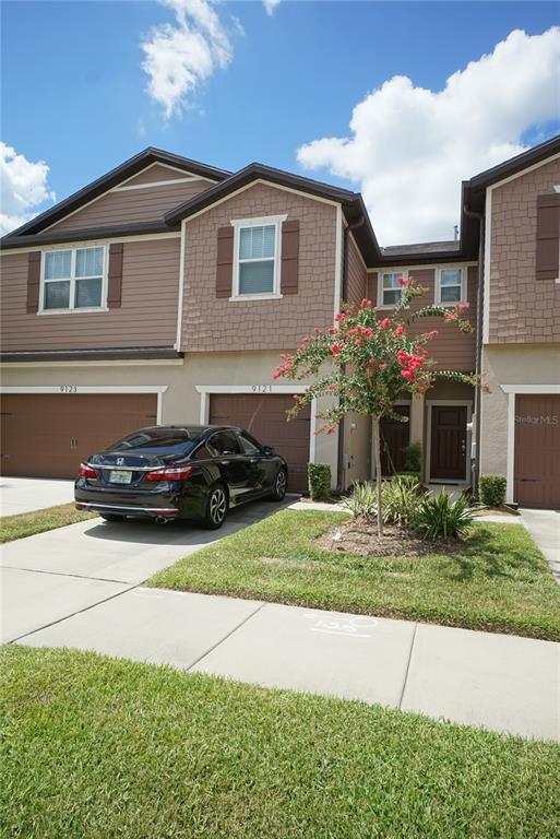 a car parked in front of a house