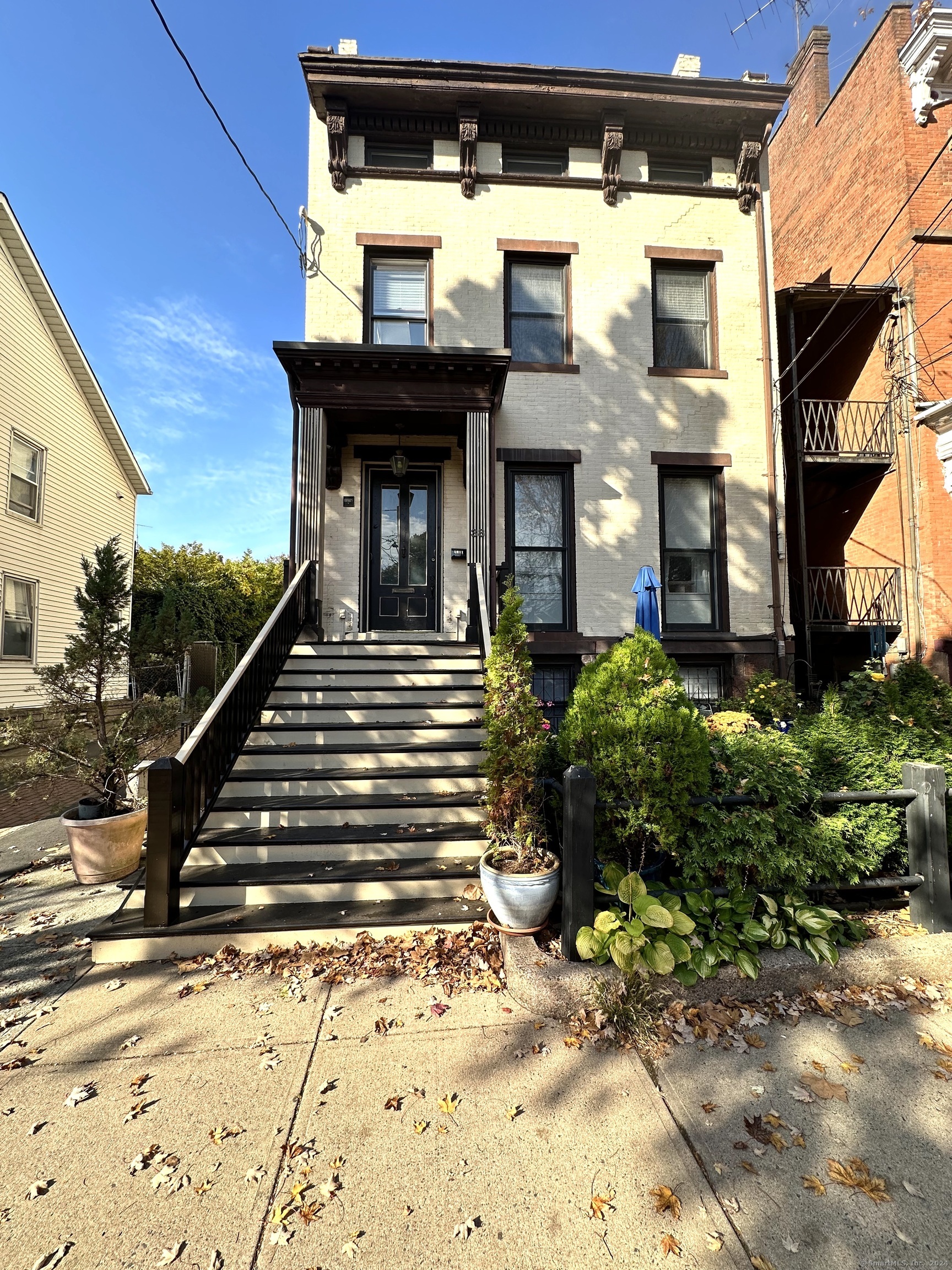 a view of a building with entryway and stairs