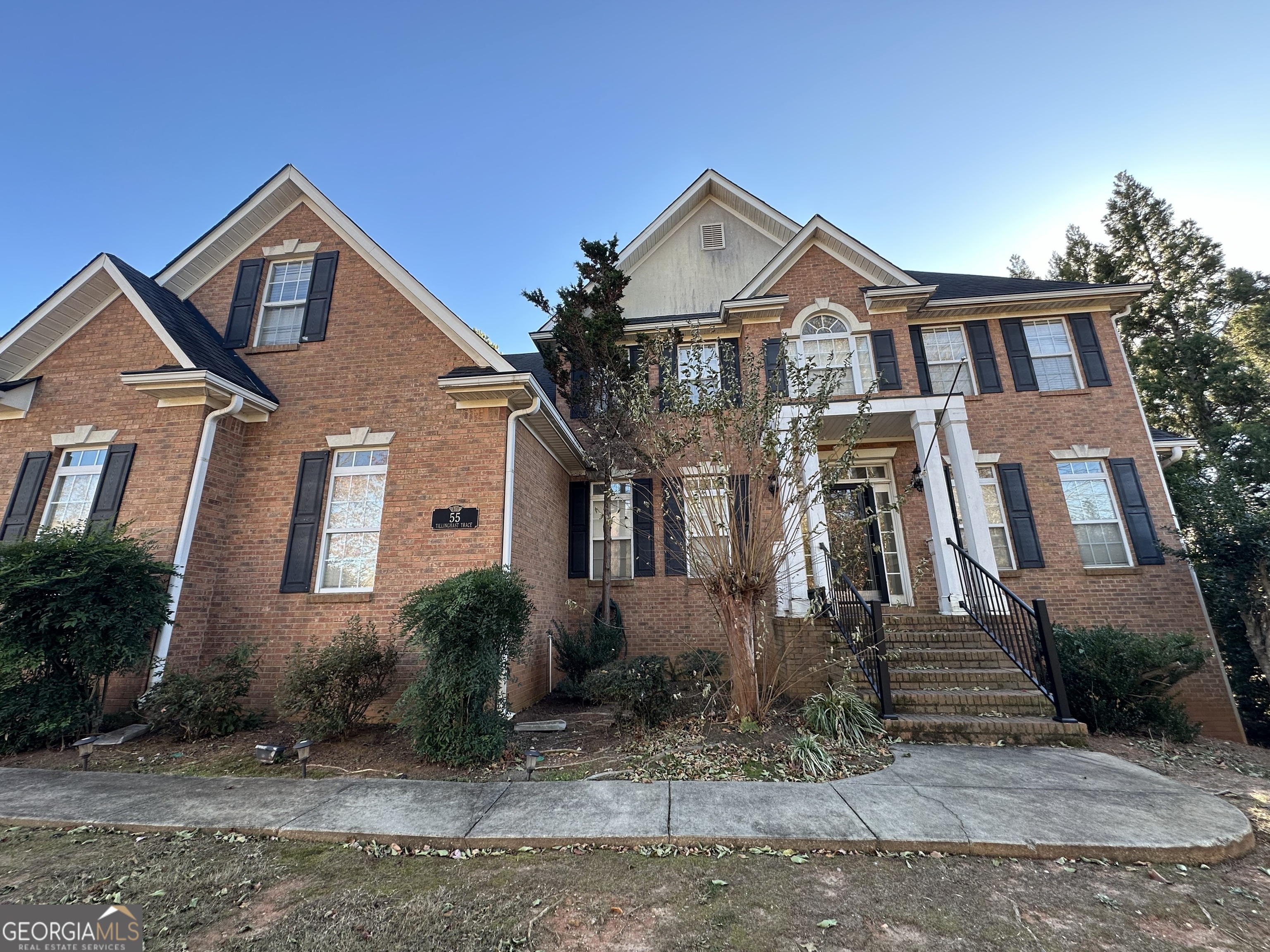 a front view of a house with a yard