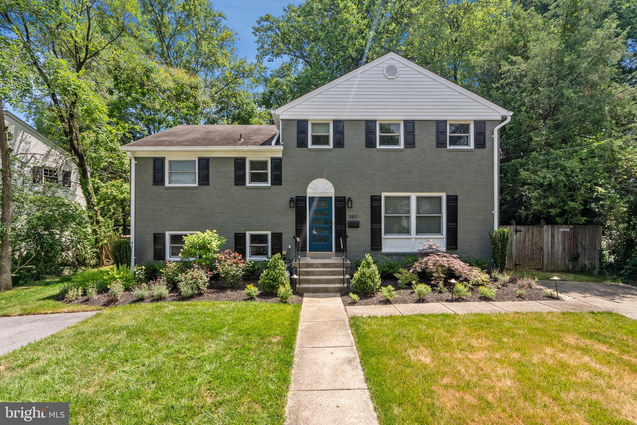 a front view of a house with a yard and porch