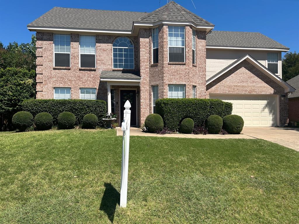 a view of a front of a house with a yard