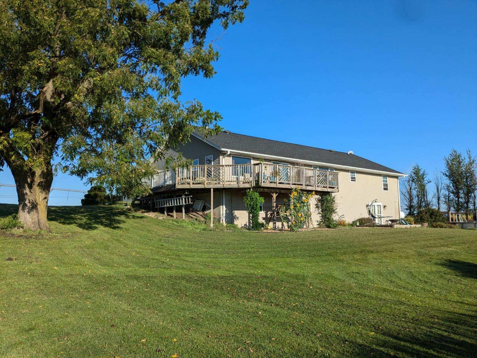 a front view of house with yard and trees