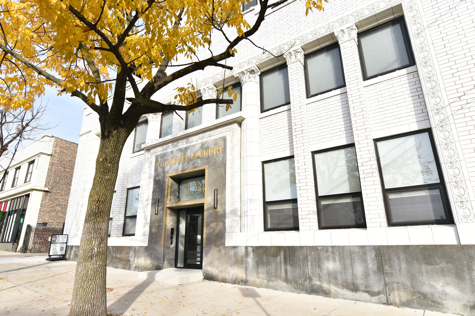 a view of a building with a tree