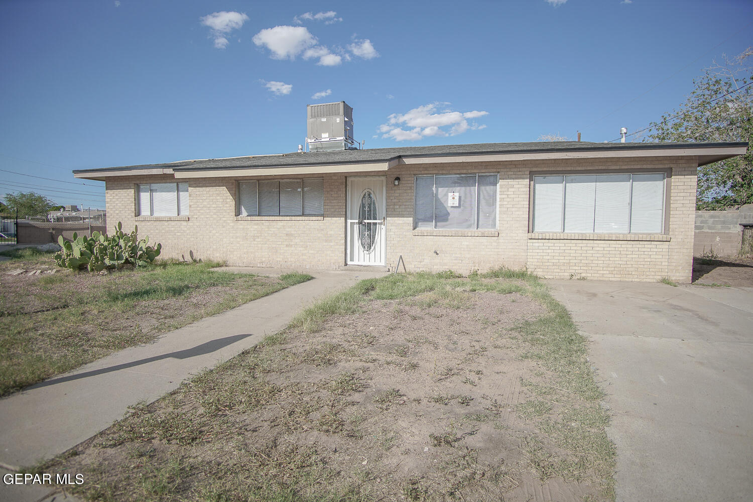 a view of a house with a backyard and windows