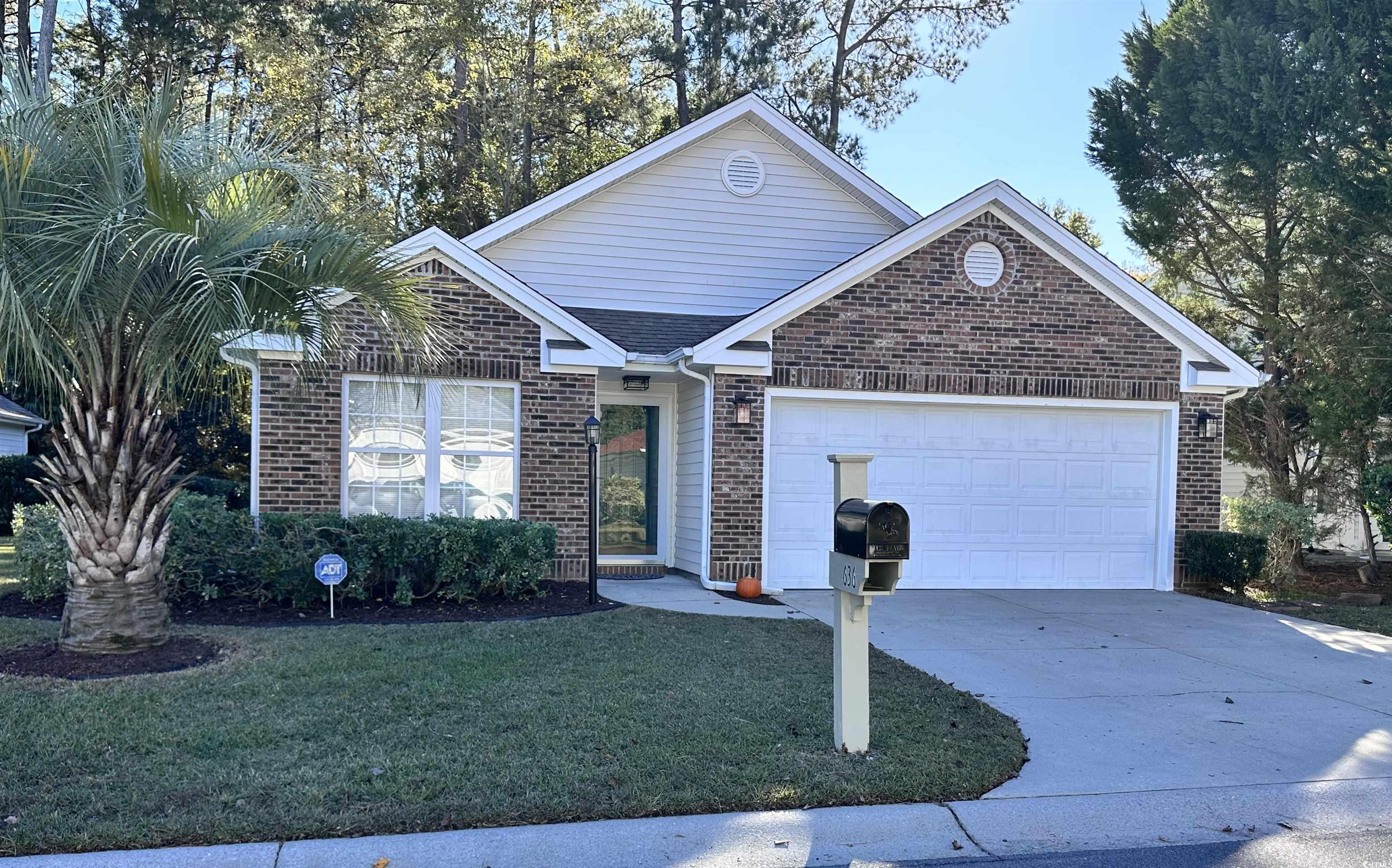 View of front of house featuring a garage and a fr